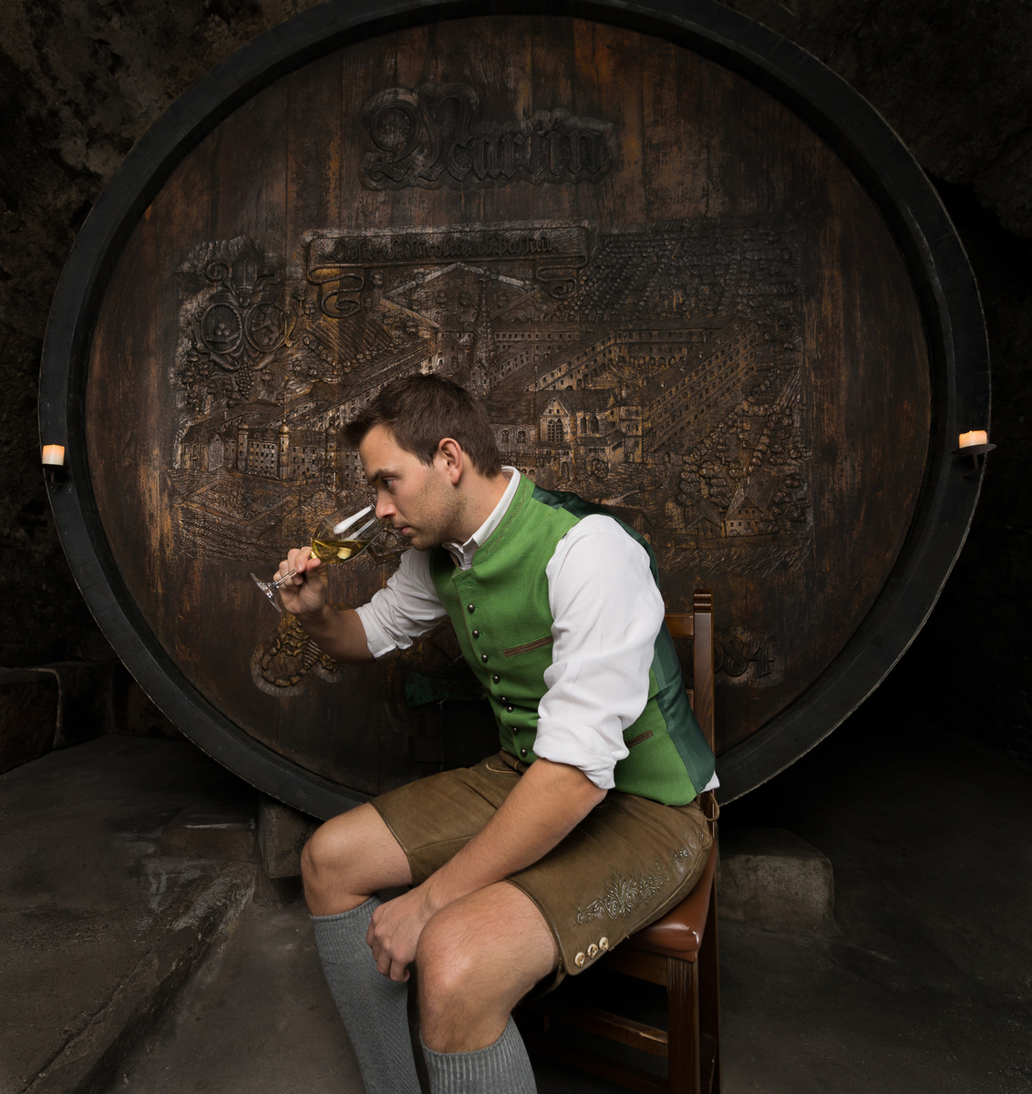 Martin Saahs in front of a barrel in the cellar of Nikolaihof